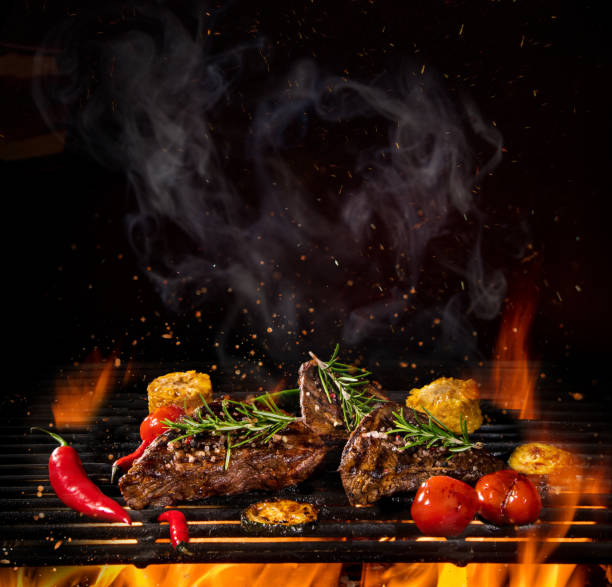 istock Beef steaks on the grill with flames 990984906