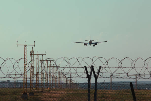 istock Plane landing - summer airport 990990710