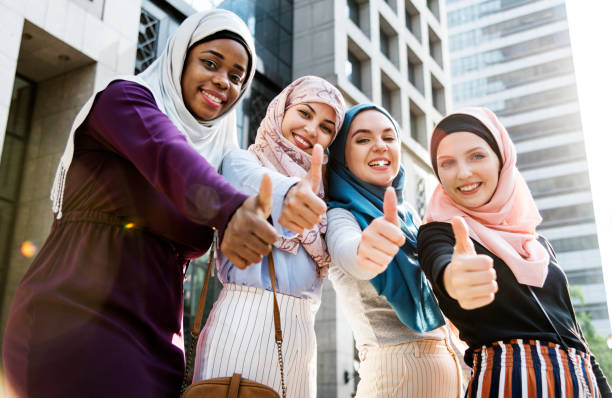 istock Group of islamic women gesturing thumps up 990992390