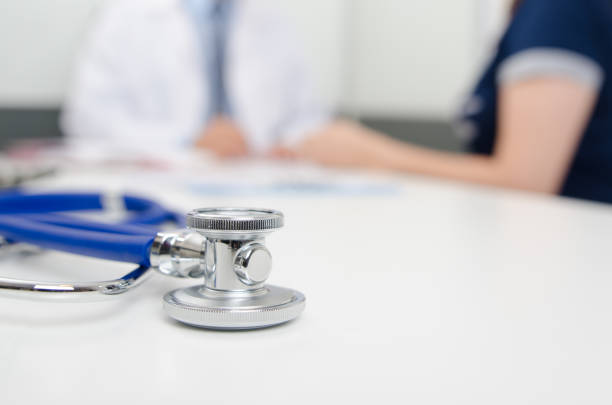 istock Patient and doctor at the office 990992952