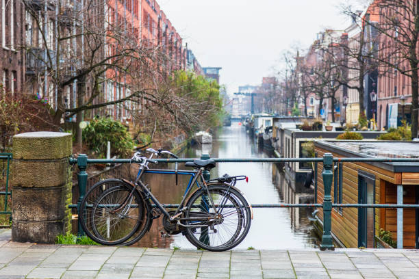 istock Typical Dutch houses built by the canal, Amsterdam, Netherlands 991001368