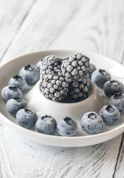 Frozen blueberries and blackberries on the plate