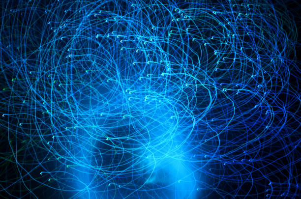 istock Abstract blue color light trails shot with long exposure at night. Light painting with circle effect. 991005158
