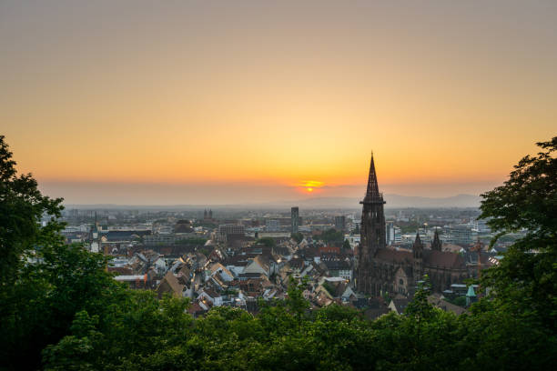 Germany, Orange romantic evening mood over Freiburg im Breisgau stock photo