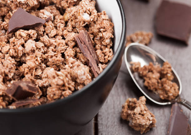 istock Bowl with organic chocolate granola breakfast 991008096