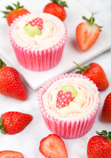 istock Fresh strawberry cupcake muffins with raw berries 991012924