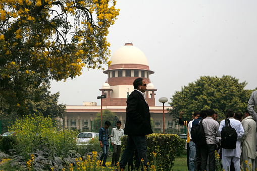 A view of Indian Supreme court main building  from the supreme court lawn inside of  the Indian Apex Court campus.
