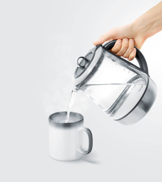 istock Blank magic mug filling with boiling water mock up 991024386