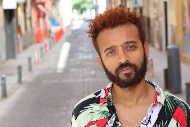 istock Handsome ethnic man with blue eyes outdoors 991032042