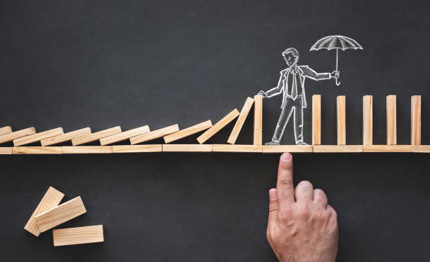 Domino Effect and Business Challenge Concept with Hand Drawn Chalk Illustrations on Blackboard