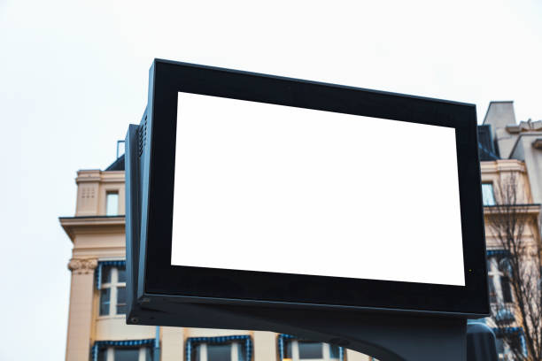 istock Empty signboard on a building with Amsterdam traditional house 991050596