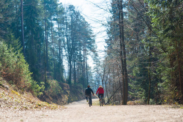 istock Couple Cycling Through Countryside Together 991056698