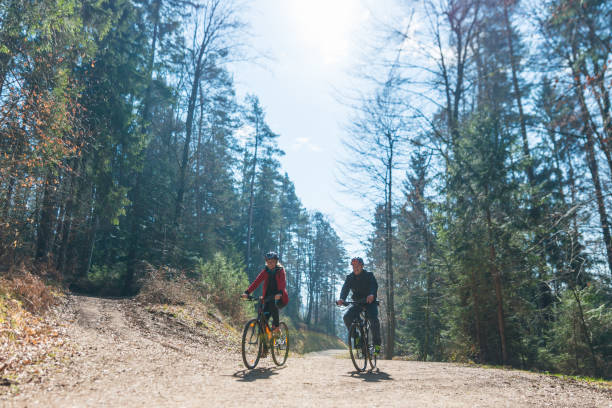 istock Couple Cycling Through Countryside Together 991056798