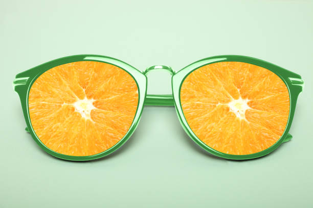 istock Bright green sunglasses with orange 991058512