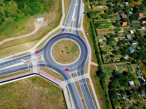 istock Roundabout intersection in three directions with island, aerial view 991058742