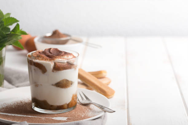 istock Tiramisu in a glass cup. Horizontal orientation with copy space 991067976