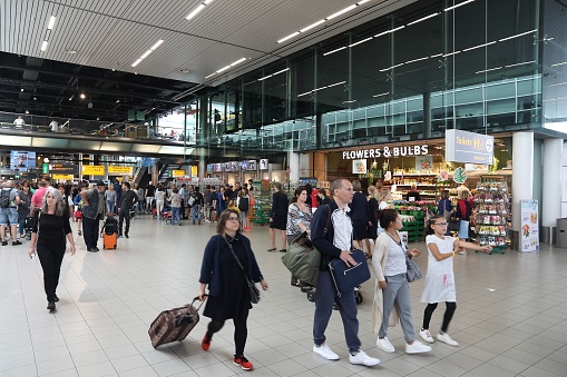 Travelers visit Schiphol Airport in Amsterdam. Schiphol is the 12th busiest airport in the world with more than 63 million annual passengers.