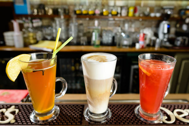 Latte and hot alcoholic cocktails at bar counter