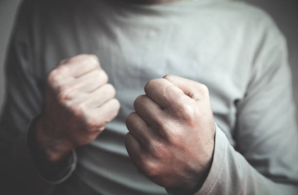 istock Caucasian man with fight gesture. Aggression concept 991072822