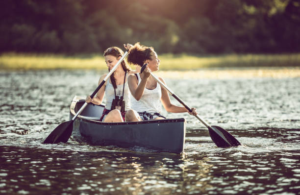 istock Two Women Canoeing on the Lake 991078584
