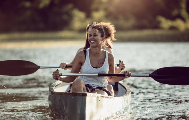 istock Two Women Canoeing on the Lake 991078606