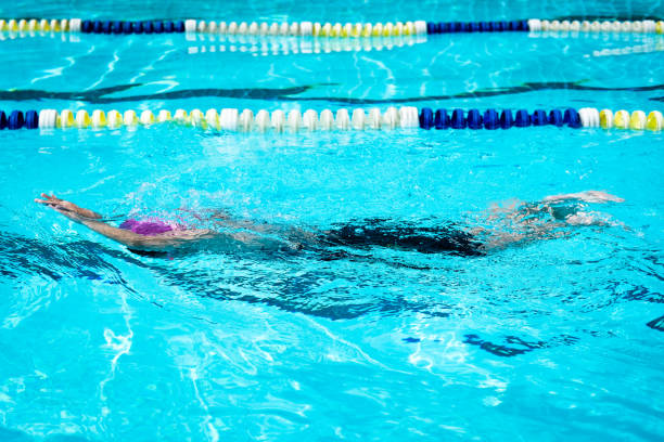 istock kid learn how to swim in swimming class 991079196