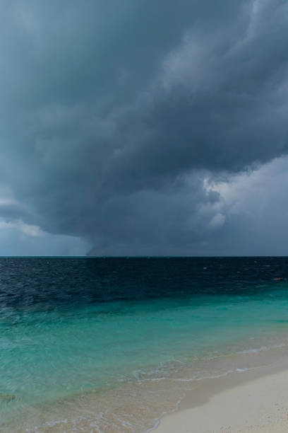 Dark hurricane cloud above tropical sea
