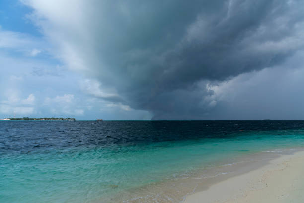 istock Dark hurricane cloud above tropical sea 991080218