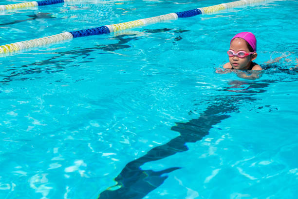 istock kid learn how to swim in swimming class 991097148