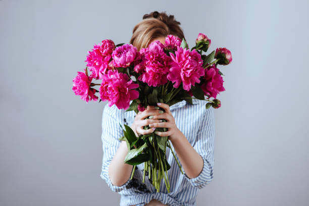 istock Fashion model with flowers. 991107792