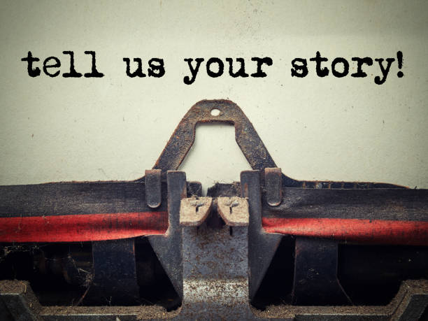 istock Tell us your story text on old typewriter covered with dust 991109474