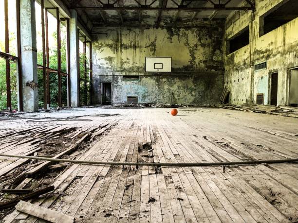Abandoned sports hall Basketball in an abandoned school building. pripyat city photos stock pictures, royalty-free photos & images