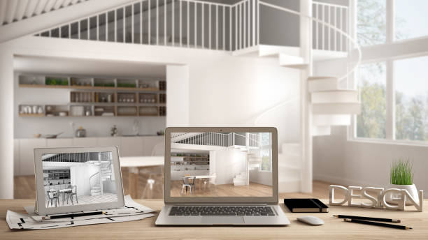 istock Architect designer desktop concept, laptop and tablet on wooden work desk with screen showing interior design project and CAD sketch, blurred draft in the background, modern kitchen idea template 991114222