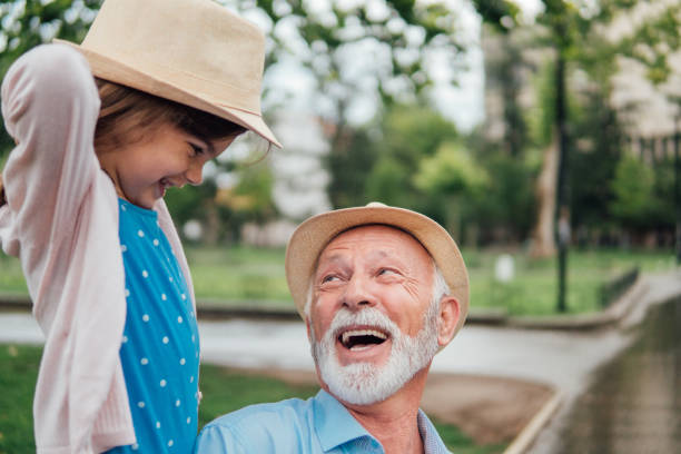 istock Grandfather looking at happy young girl 991114494