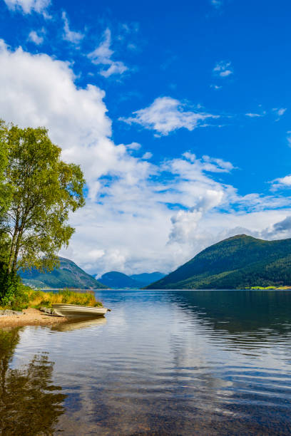istock boat on the mountain lake 991121256