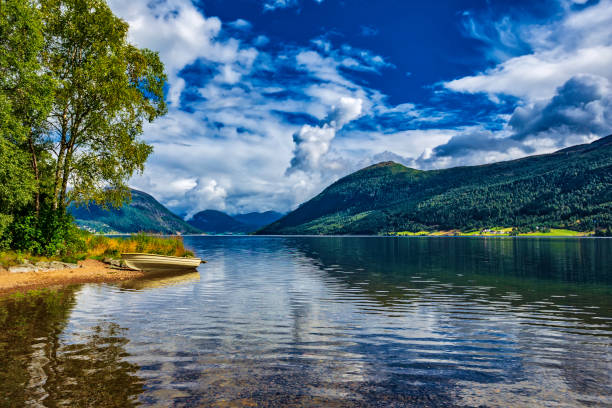 istock boat on the mountain lake (HDRi) 991121268