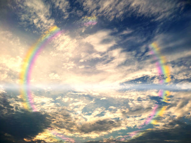 istock reflection of rainbow and cloud on lake water 991131320