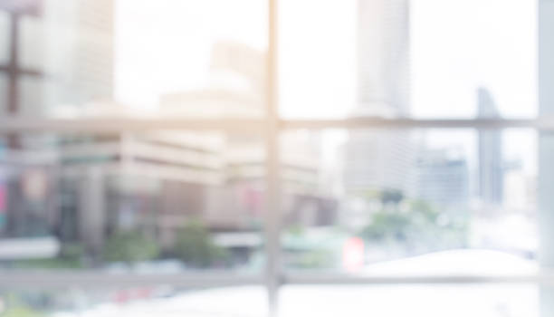 istock Blurred abstract wall building with big window glass background.material decoration design 991136520