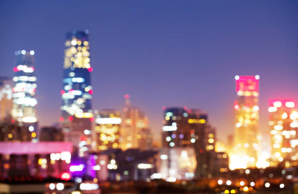 istock Night blurred bokeh light city office buildings in Beijing China 991137046