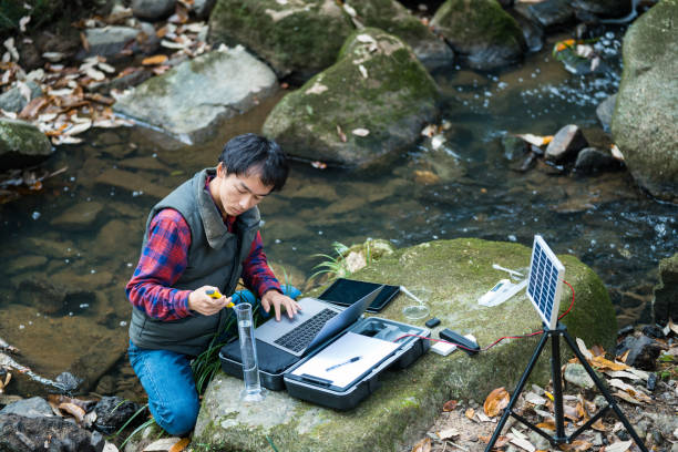 istock A scientist monitoring water quality from a solar powered field laboratory 991138410