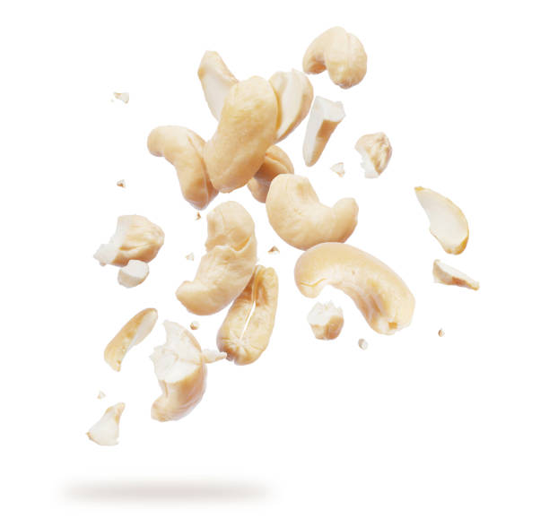 istock Cashew crushed into many pieces close-up isolated on white background 991151216