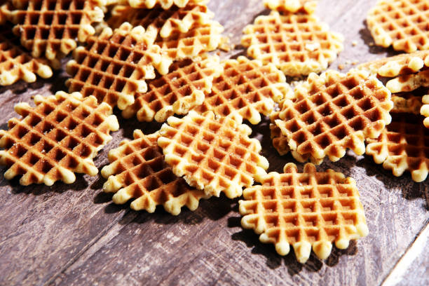 istock Traditional belgian waffles on wooden background 991154968