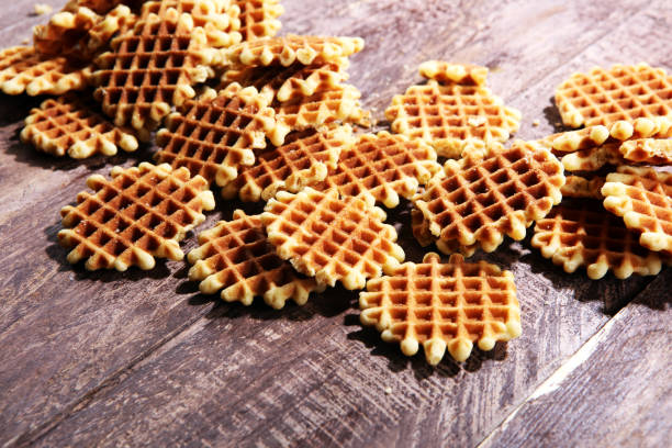 istock Traditional belgian waffles on wooden background 991155220