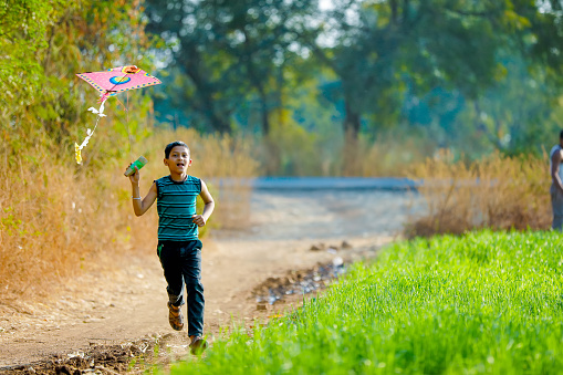 indian child playing with kite