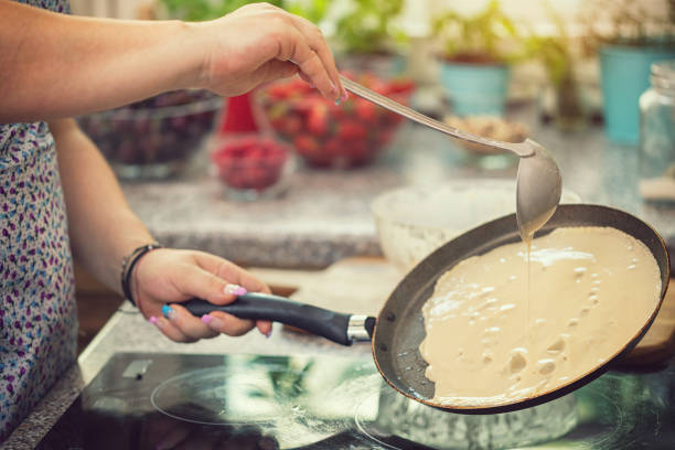 istock Woman Preparing Pancakes 991165150