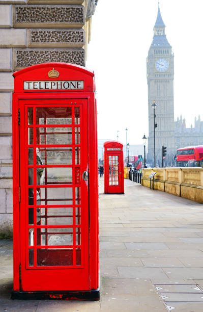 istock Red telephone boxes and Big Ben in London. 991200180
