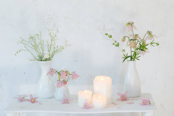 istock white vintage interior with flowers and candles 991204002