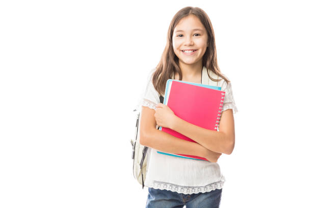 Young hispanic student girl holding books