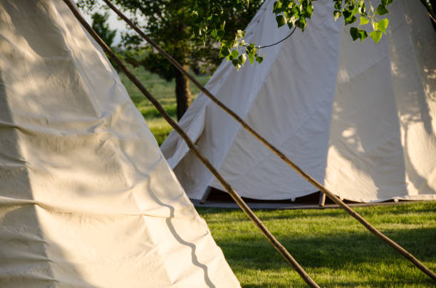 istock Group of Tipis Standing Among the Trees 991214574
