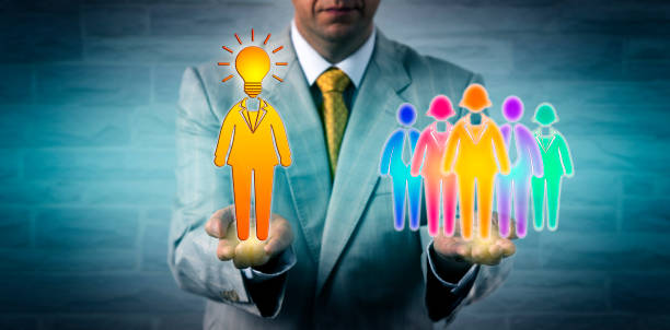 istock Recruiter Presenting Female Leader To Work Team 991215472